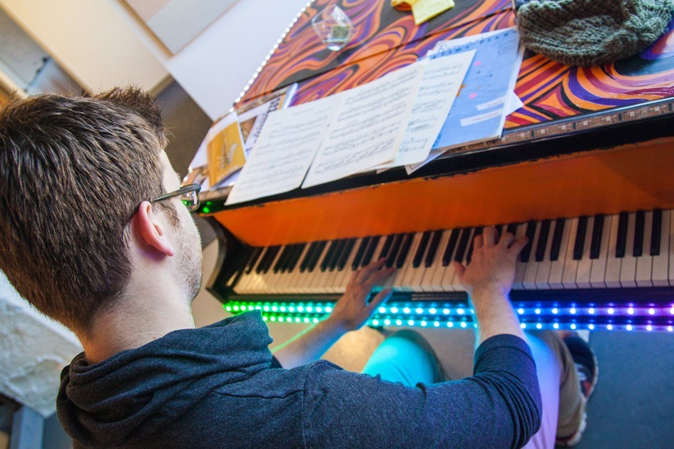 Many of the Asana team members camp together at the annual Burning Man festival, for which they created this piano art piece. LED Lights activate above the keys as you play them.