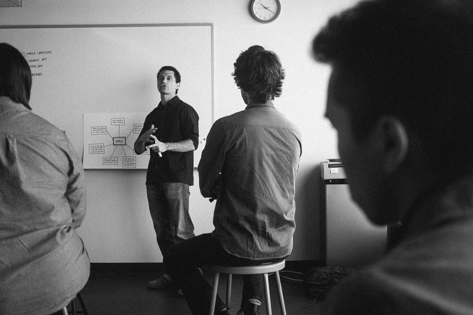 Jason presenting in a&nbsp;critique session about his work on Pinterest’s mobile navigation patterns.