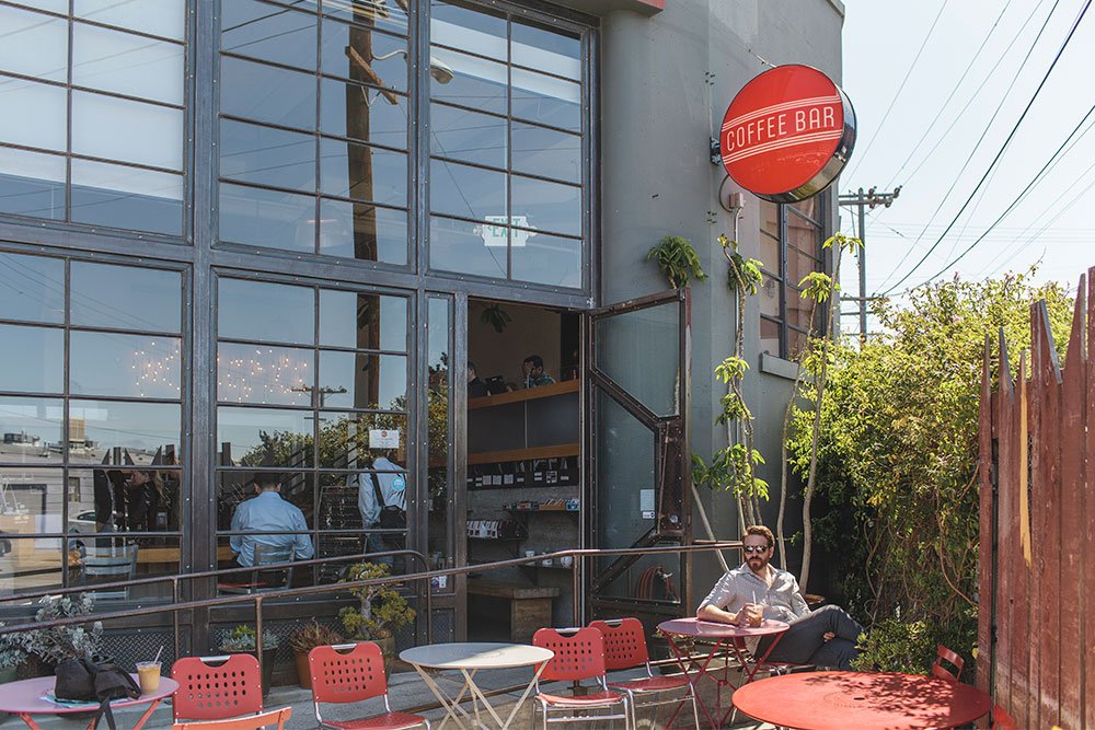 Ryan is shown here enjoying his morning iced coffee at Coffee Bar.&nbsp;The Mission is home to some of the best restaurants and coffeeshops in America.